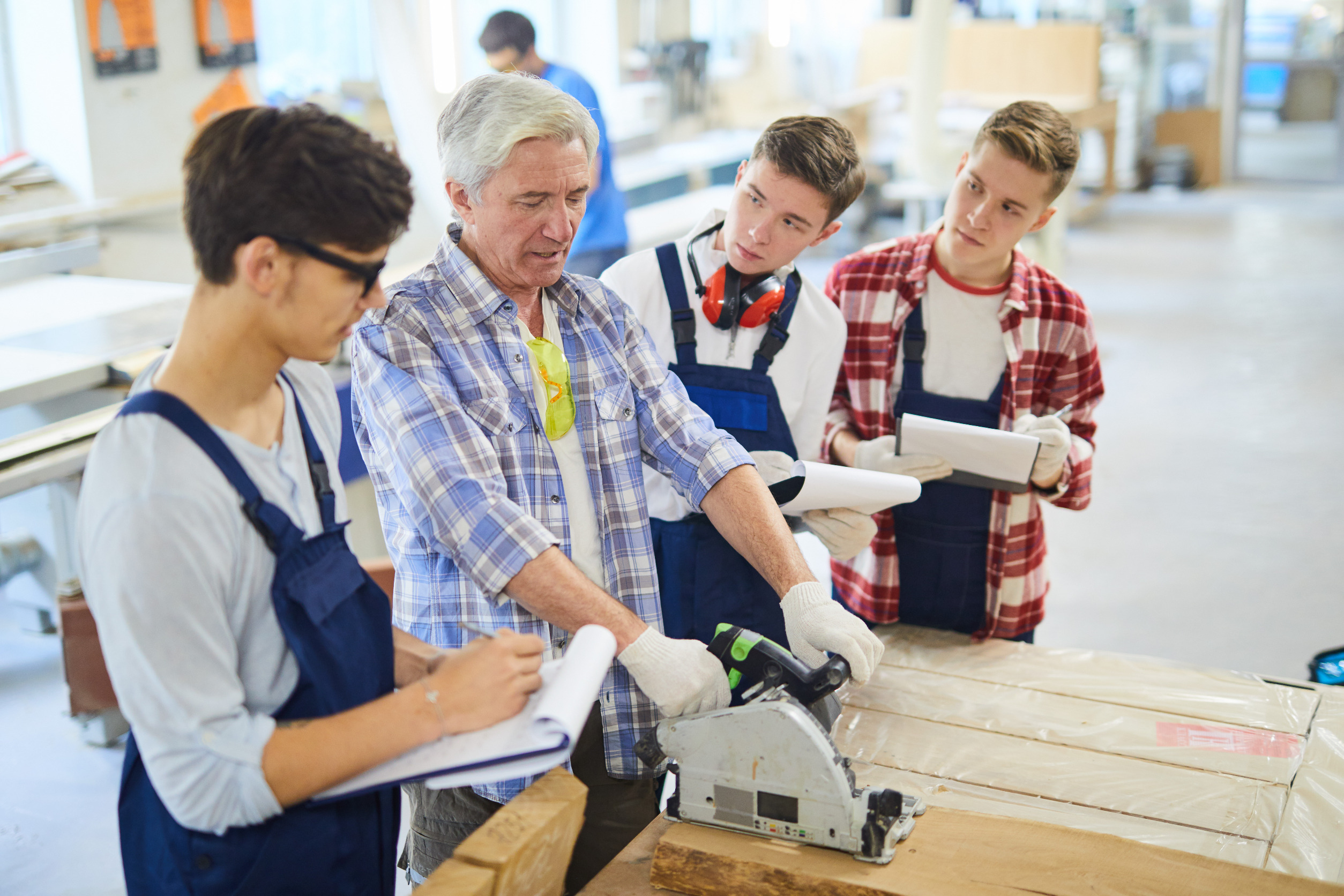 Apprenticeships. Leader with 3 young boys